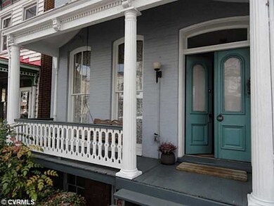 Exterior Front - Spacious porch with swing and flo