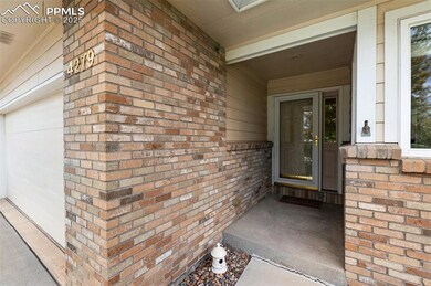 Doorway to property featuring brick siding