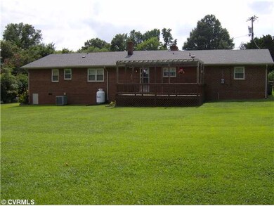 Yard/Garden - Rear view of exterior showing deck w/ pergola