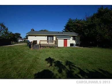 Exterior Back - Wood deck. Storage shed.