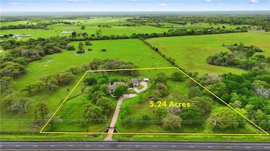 Aerial view of sparsely populated area featuring p