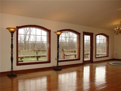LIVING ROOM WITH NATURAL HARDWOOD FLOORS