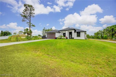 Prairie-style home featuring driveway, an attached