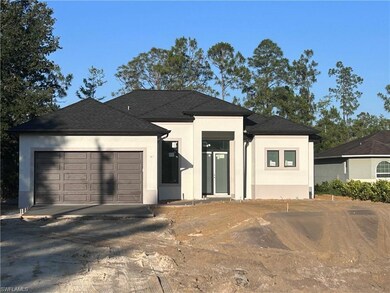 View of front of property with stucco siding, an a