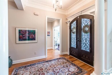 Impressive Custom Ironwork Doors Welcome You Into This Stunning Home.