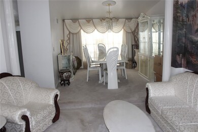 Formal living room, step up dining room