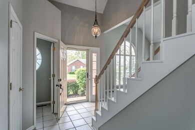 Light and Bright two story entry provides a welcoming and spacious area to receive guests. Flooring is tile,which is ideal for foot traffic and cleaning is super easy!