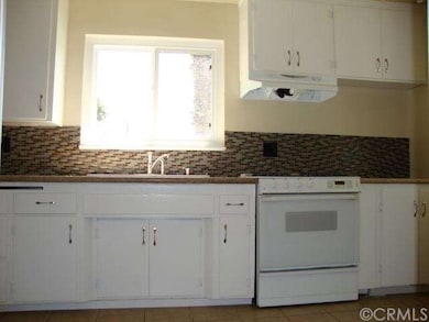 Granite counters and tiled back splash