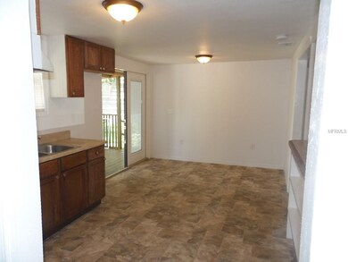 Kitchen with Large eat in area leading to back por