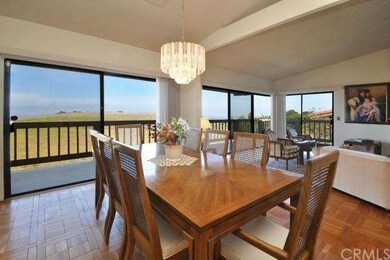 Formal dining area opens to the living room.