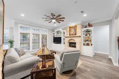 Living area with visible vents, light wood-type fl