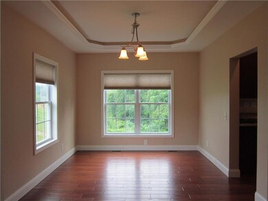 Dining room with upgraded tray ceiling.  Just one 