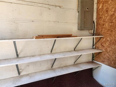 Staircase featuring electric panel