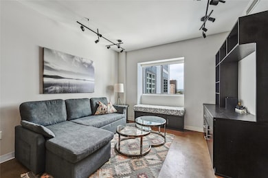 Living room featuring finished concrete flooring,