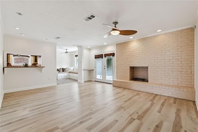 Enjoy the natural light in this den area w/firepla