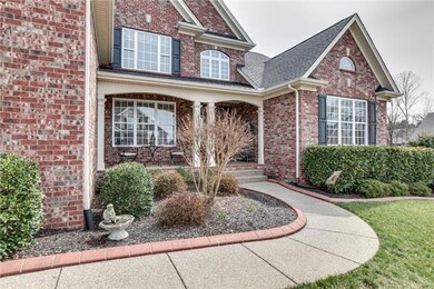 Curb appeal and immaculate exterior will have you at hello!  Curbed landscaping beds and around trees, irrigation, covered porch....what more could you ask for?