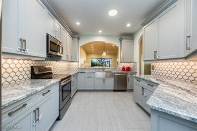 Kitchen featuring stainless steel appliances, gray