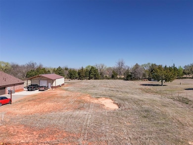 View of yard with a garage and an outdoor structur