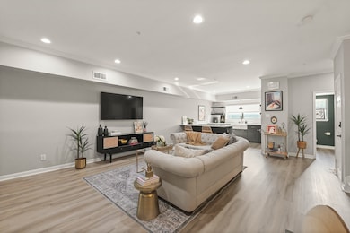 Living area open to kitchen and dining