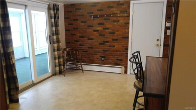 The eating area of the kitchen has a removable bre