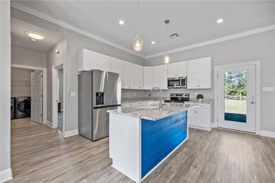 KITCHEN OVERLOOKS DINING