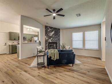 Living room featuring ceiling fan, a premium firep