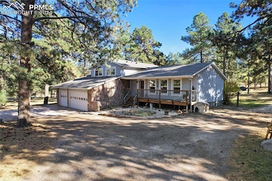 View of front of property with a deck and oversize