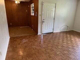 Living room featuring dark parquet floors and ceil