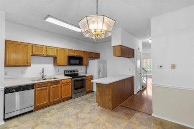 Kitchen featuring light countertops, an inviting c