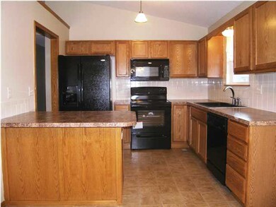 The kitchen as seen from the formal dining. Note t