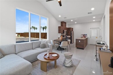 Living room featuring visible vents, ceiling fan, vaulted ceiling, recessed lighting, and marble finish floor