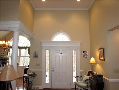 The Welcoming Entry Door is Framed by 2 Sidelites 