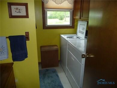 Full bath with laundry area on main level.