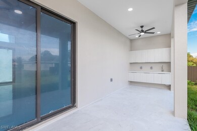 View of patio featuring ceiling fan and a sink