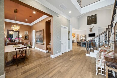 Grand entry with two story ceiling which opens to