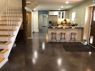 View of the kitchen/bar seating from the living ro