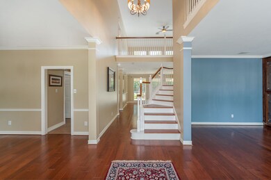 Once inside, you will find this 2-story entry to be light and bright!  It is flanked by a formal dining and living room!  The wood treaded staircase leads to the upstairs living spaces!