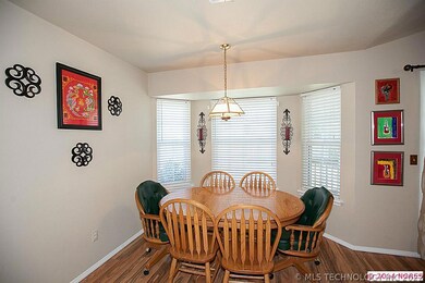 Dining room with bay window has ample space for la