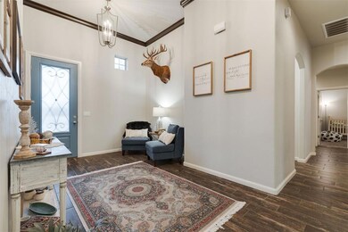 Entrance foyer with arched walkways, visible vents