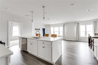Kitchen featuring stainless steel dishwasher, ligh