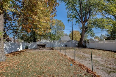 Large backyard has vinyl privacy fence