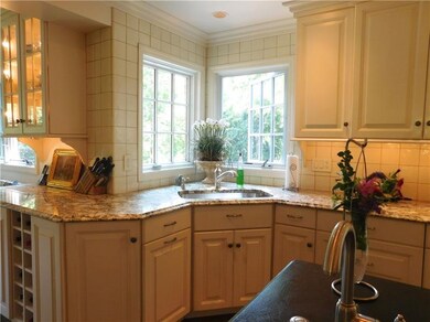 While at the corner sink, open the corner Pella wi