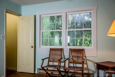 Main Floor Full Bath: The main floor bath includes a modern vanity and a tiled shower/full tub.