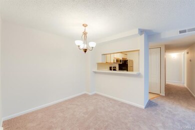 Dining area with service opening to kitchen.