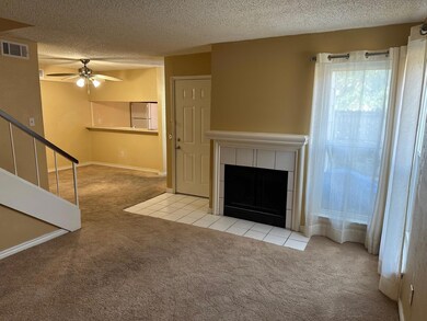 Unfurnished living room featuring a fireplace, cei