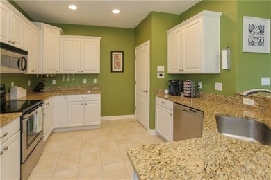 You could make yourself right at home with this kitchen; granite tops, stainless appliances and sink.
