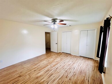 Another view of primary bedroom