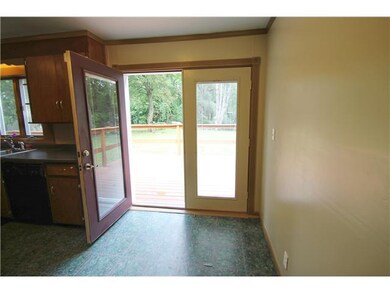 Kitchen. French doors open onto deck.  Note the in