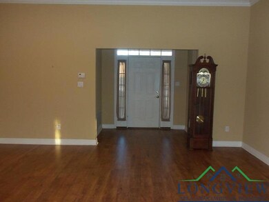 Entrance foyer with dark hardwood / wood-style flo