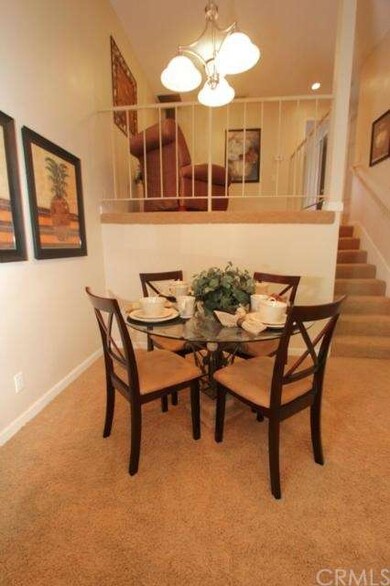 View from kitchen of dining area and open loft are